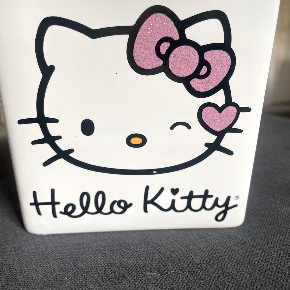This is an adorable Hello Kitty ceramic decoration.